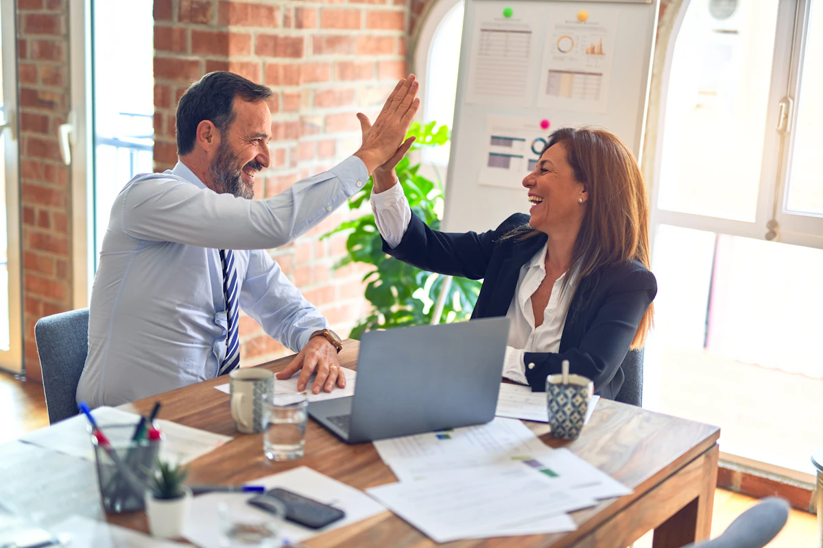 Project management professionals celebrating certification success
